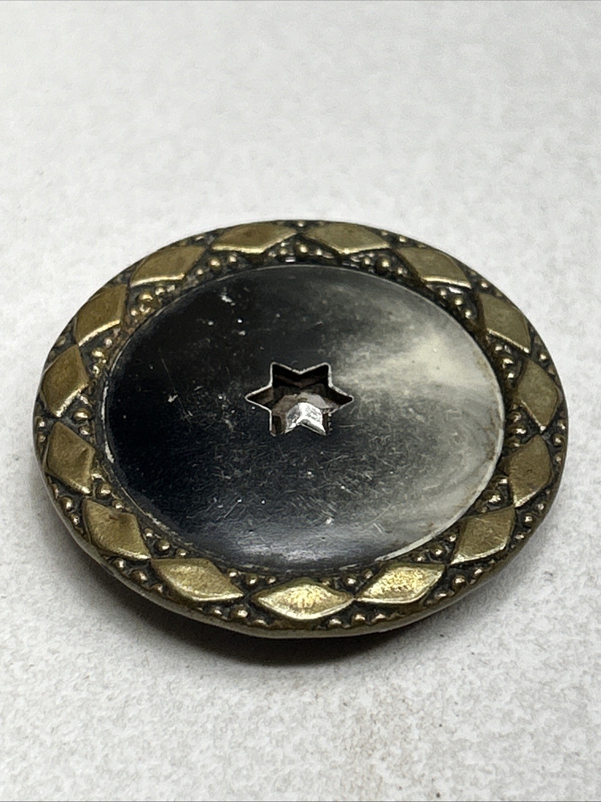 Antique Metal Celluloid Button Shooting Multifaceted Six Point Star Center