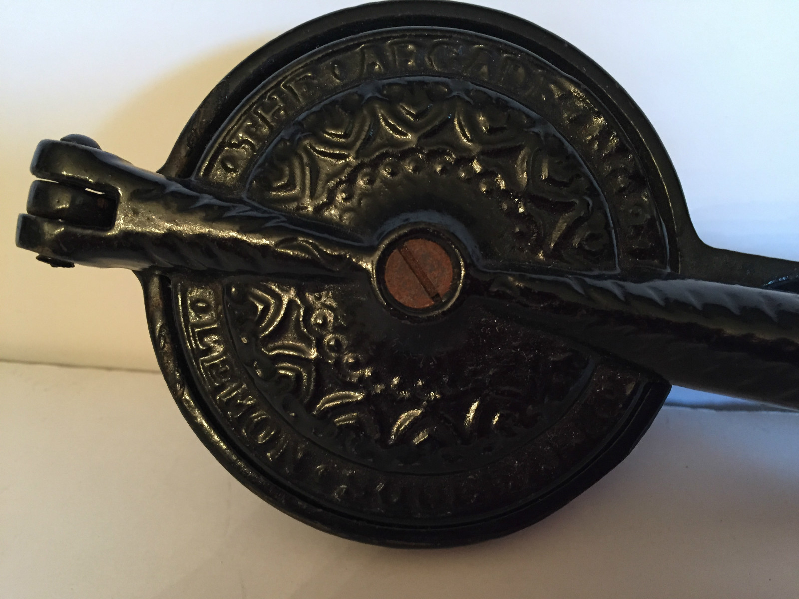 ANTIQUE ARCADE CAST IRON LEMON SQUEEZER. IRONSTONE INSERT.