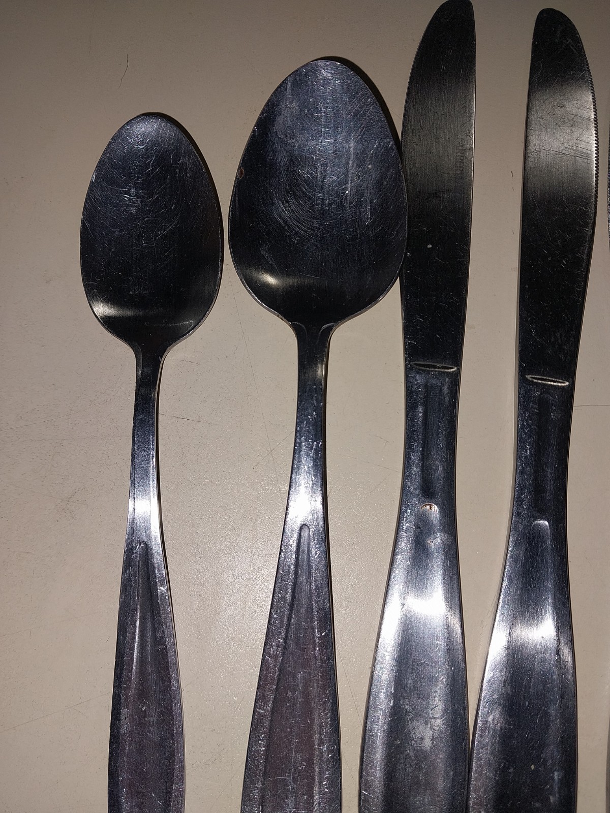 2 spoons & 3 knives farberware used