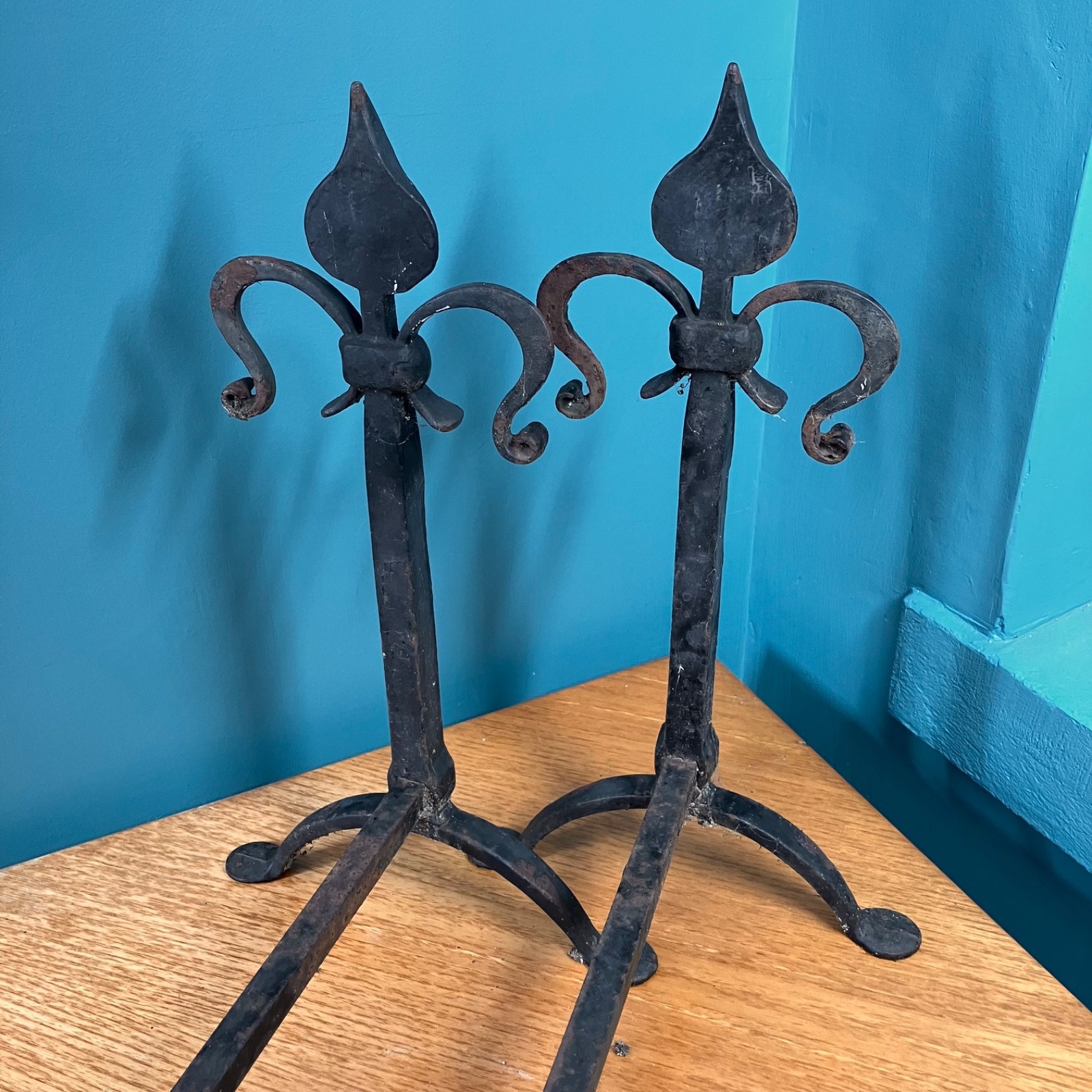 Pair of Antique Fleur-De-Lys Wrought Iron Fire Dogs