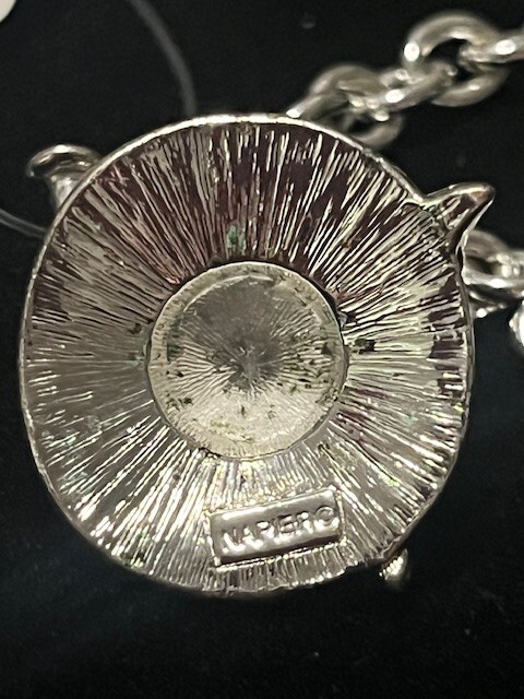 CLASSIC STAMPLED NAPIER SILVER TONE BRACELET WITH HAT CHARM & TOGGLE CLASP