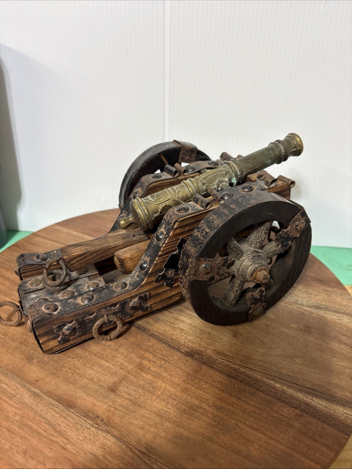 Vintage Spanish cannon replica wood base and copper cannon and steel studs