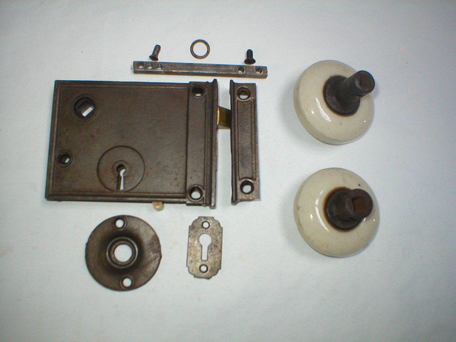 Antique Surface Mount Door Hardware with interesting Milk Glass Doorknobs