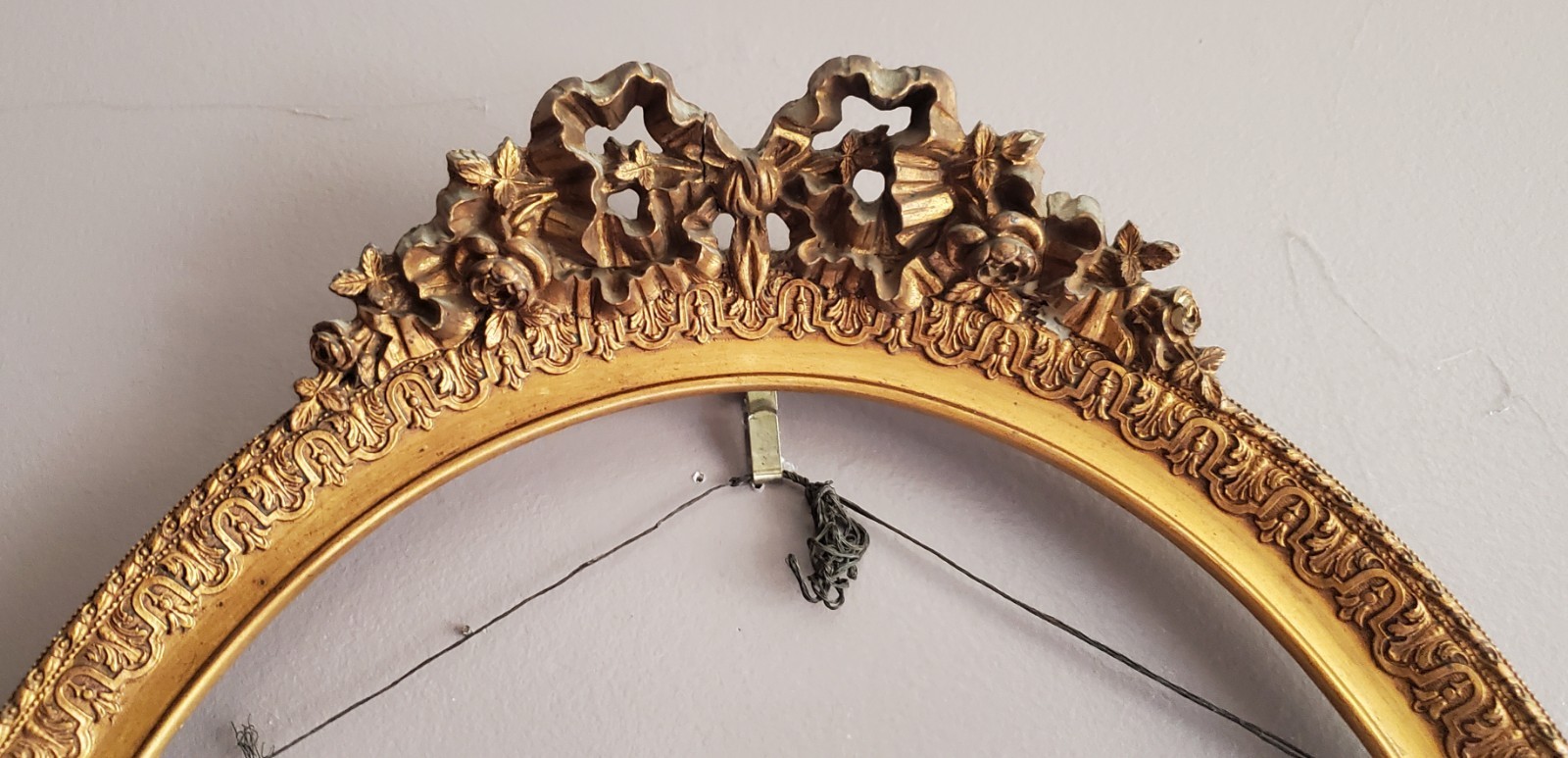 * French Louis XVI-style oval gilt frame floral garlands & ribbon antique