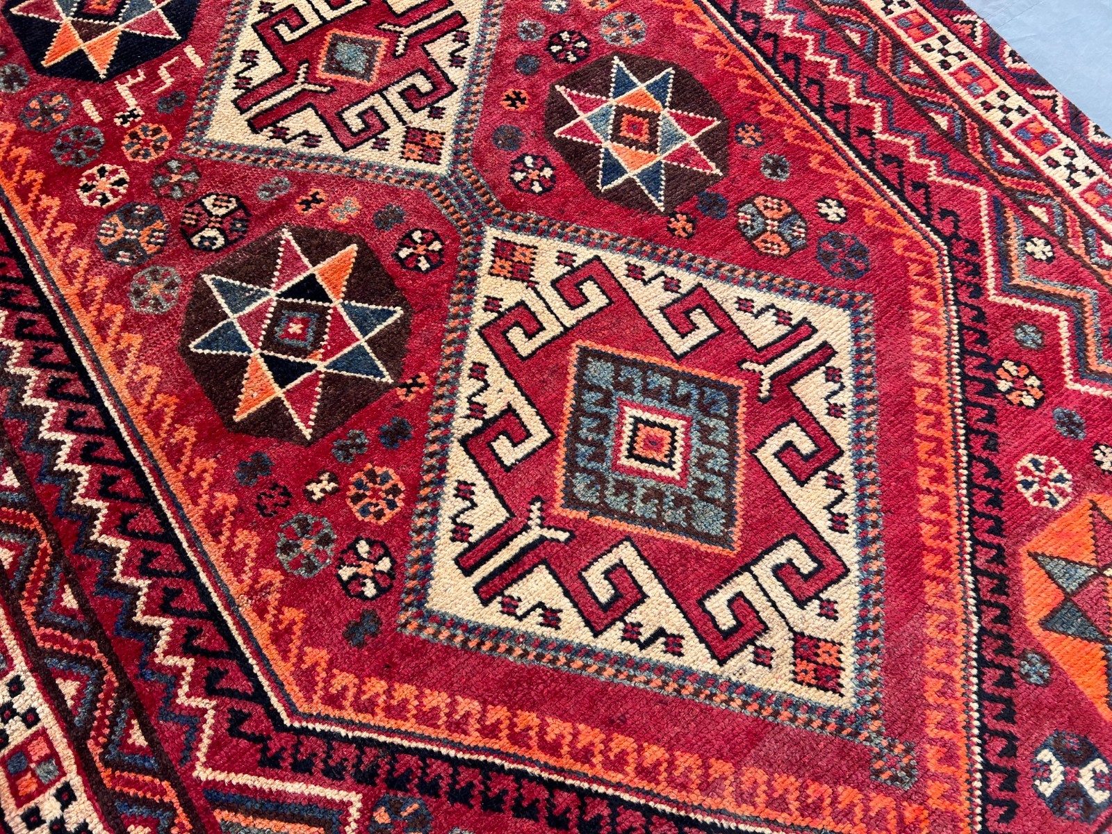 Vintage Turkish-Inspired Rug | 4’9″ x 7’10” Faded Geometric Medallion Area Rug