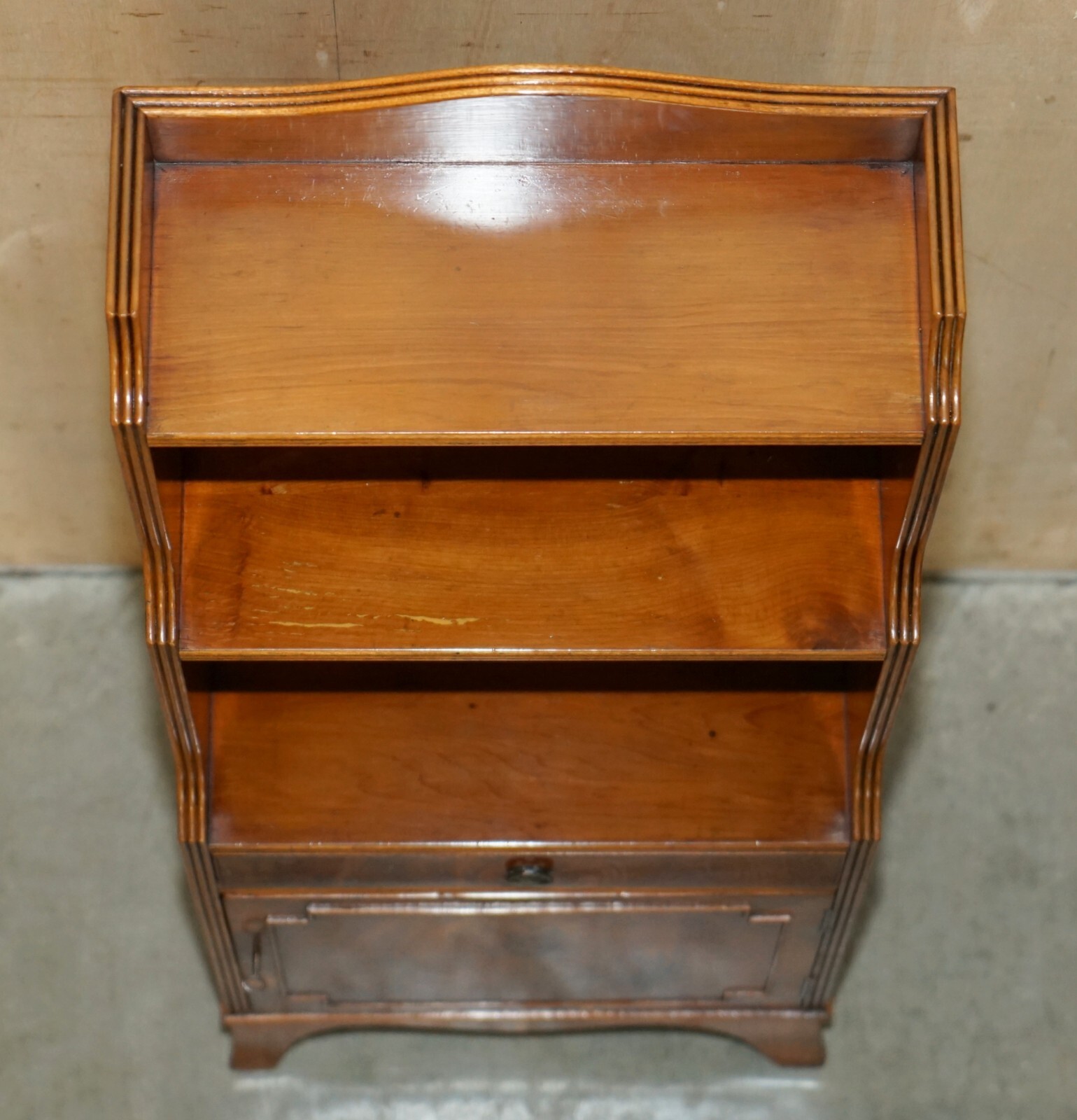 PAIR OF VINTAGE ENGLISH FLAMED MAHOGANY WATERFALL BOOKCASES WITH CUPBOARD BASES