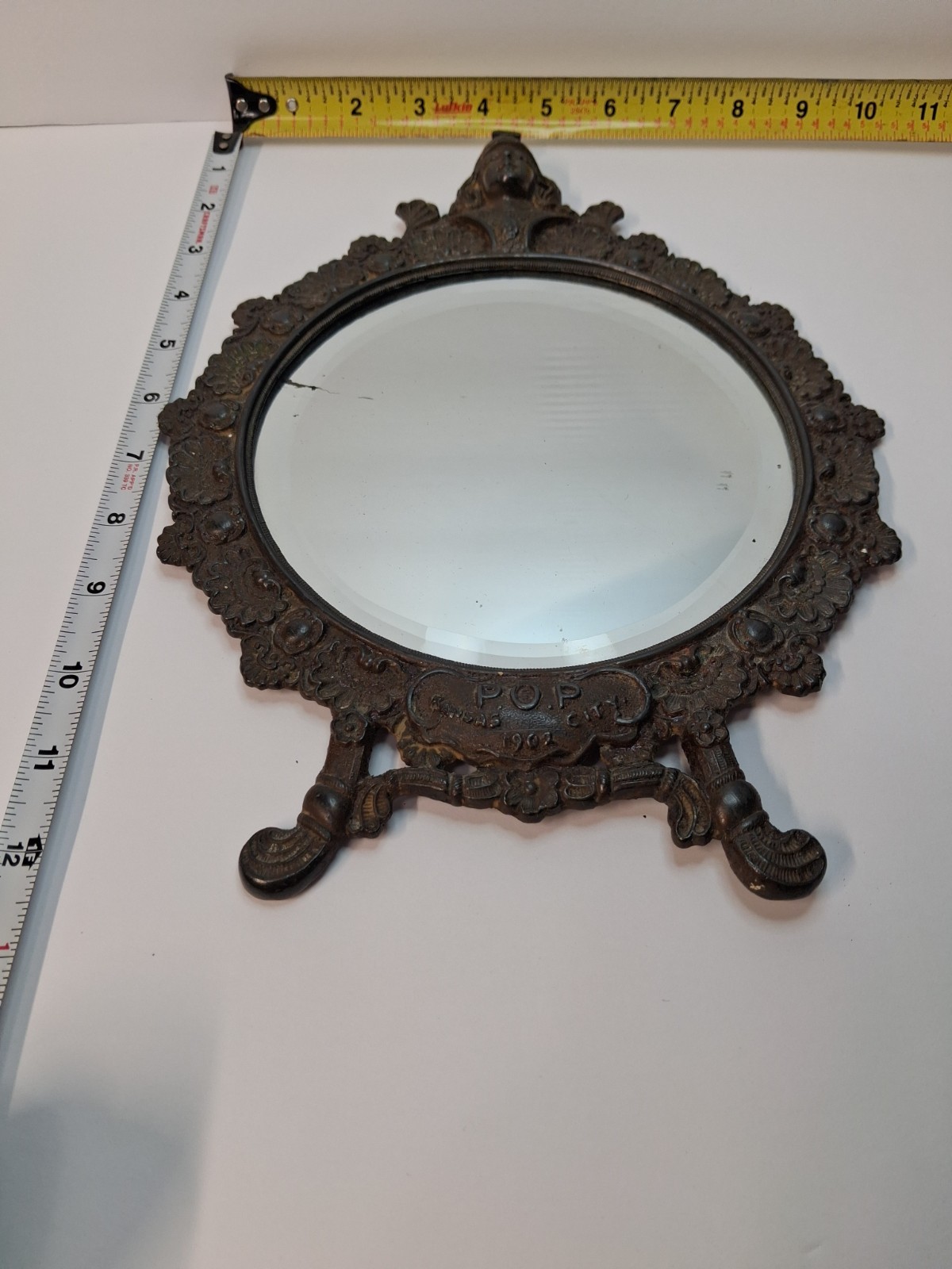 Old Edwardian decrotive cast metal vanity mirror. Signed 1902 POP Kansas City.