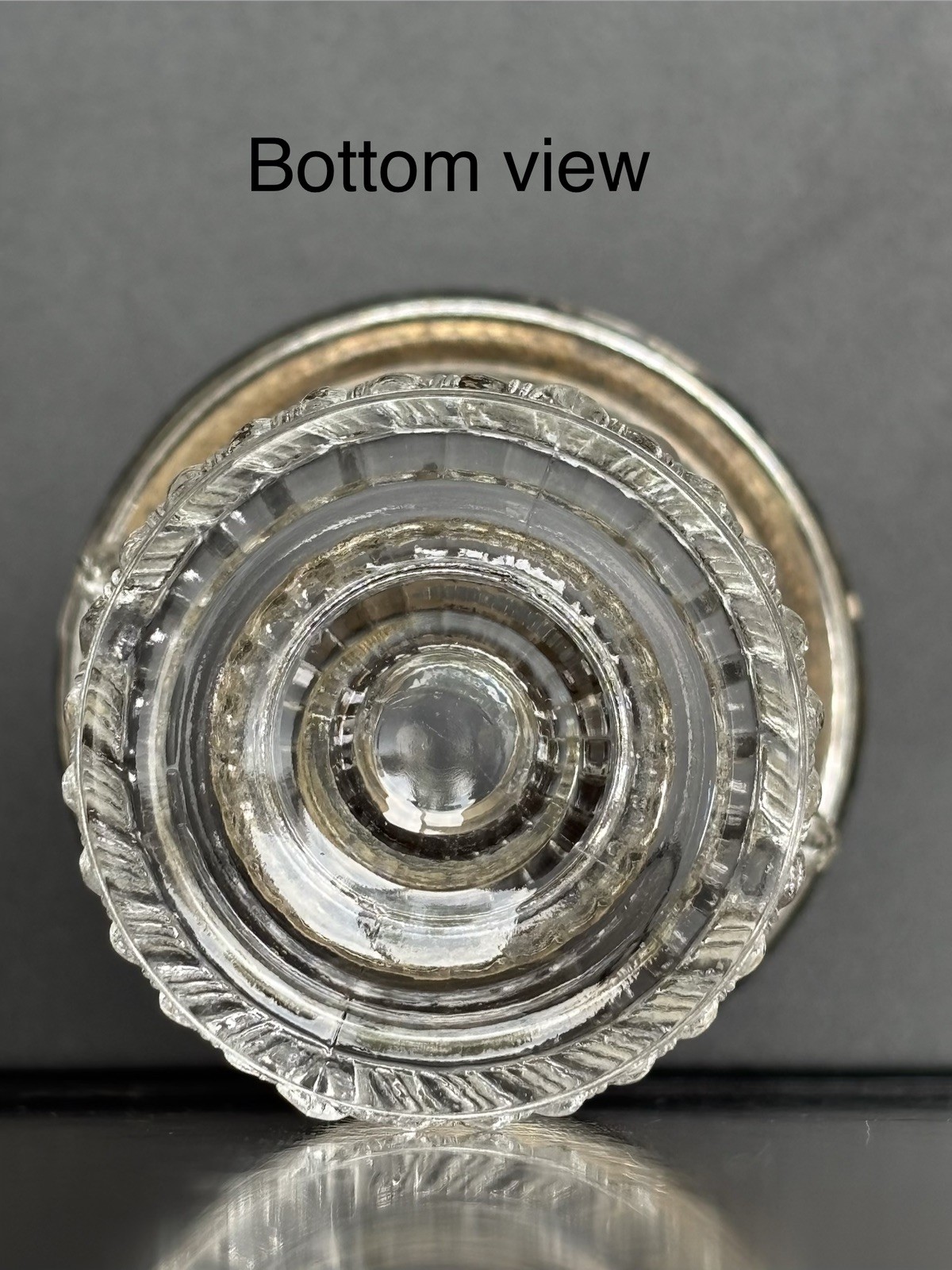 F.B Roger pressed glass toothpick holder with a silver rim and molded lion heads