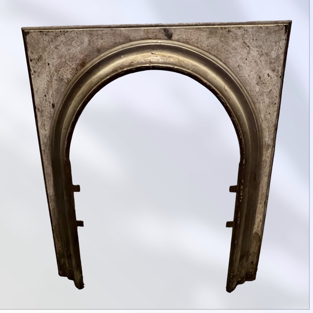 ANTIQUE ARCHED OPENING CAST IRON FIREPLACE SURROUND 31.5 X 28.25”
