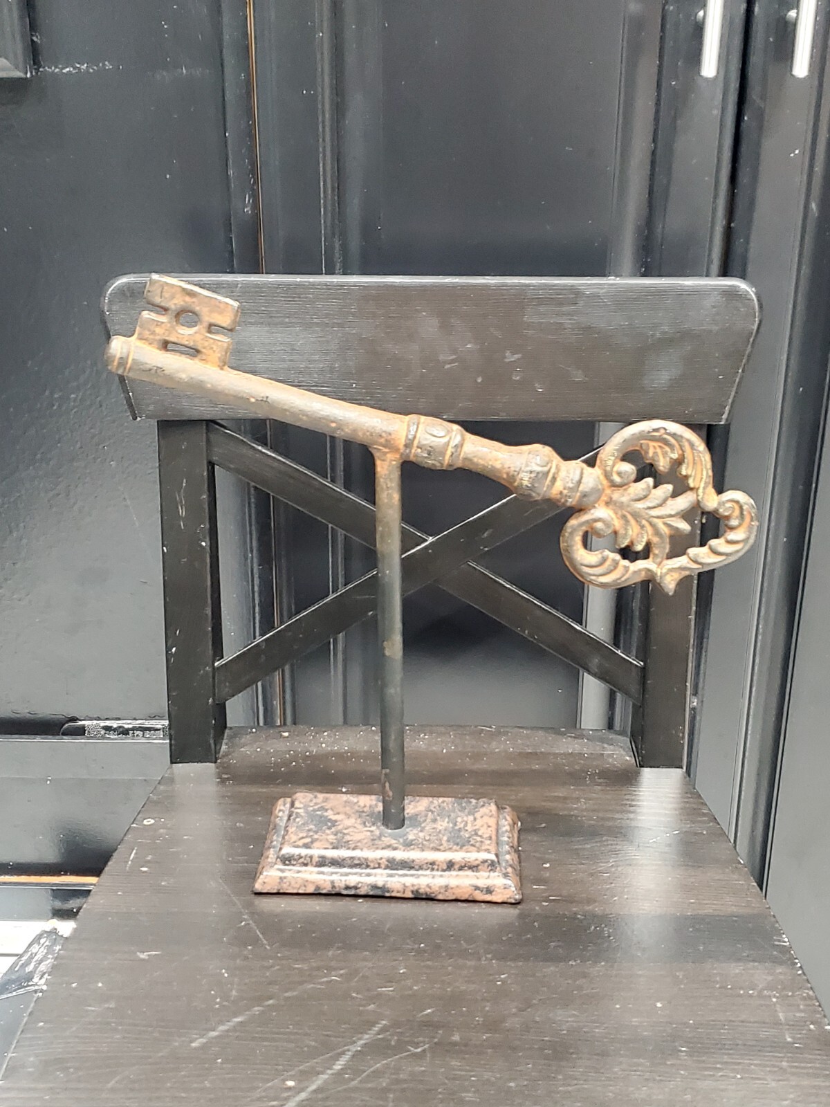 13in Antique Large solid cast iron key heavy on stand. Old church castle palace?