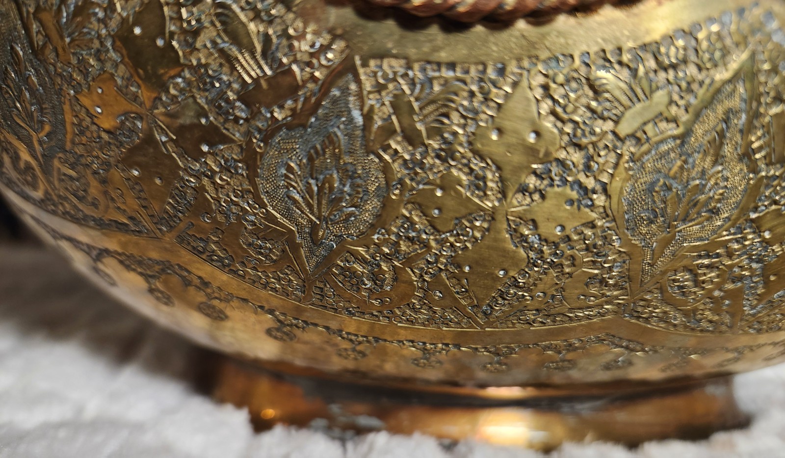 Antique Middle Eastern brass decorative set with engraved floral motifs.