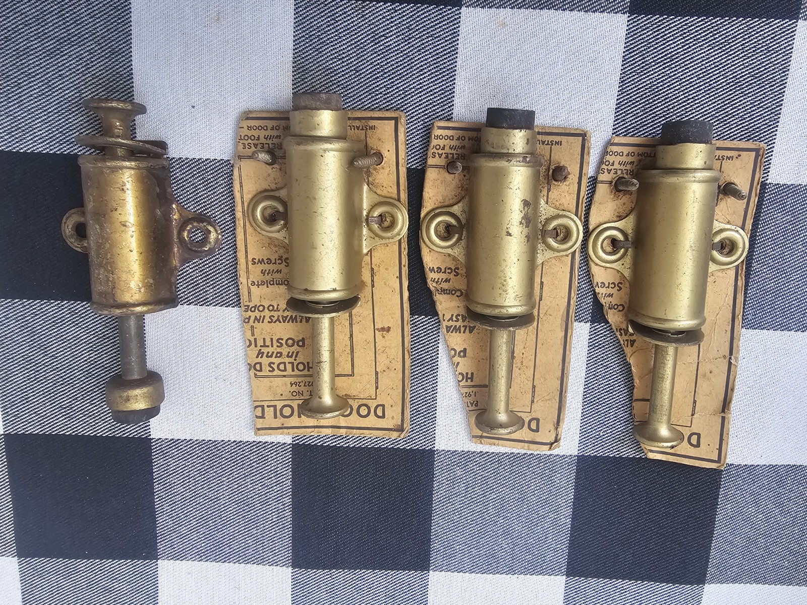 (4) Vintage NOS Brass Plated Press Down Door Stop Holders Made In USA (3 New)