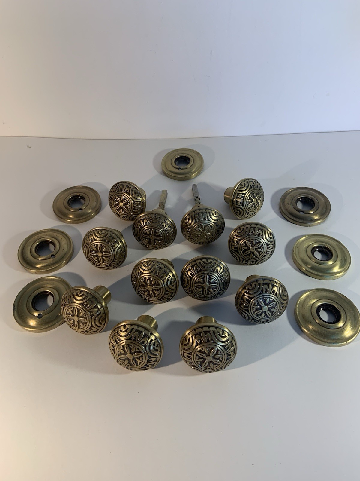 12 Door Knobs And 7 Rosettes . Good Quality Ornate Solid Brass .