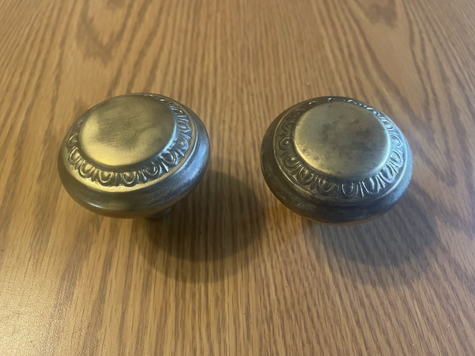 Pair of Antique Sargent Egg & Dart Crete Brass Door Knobs