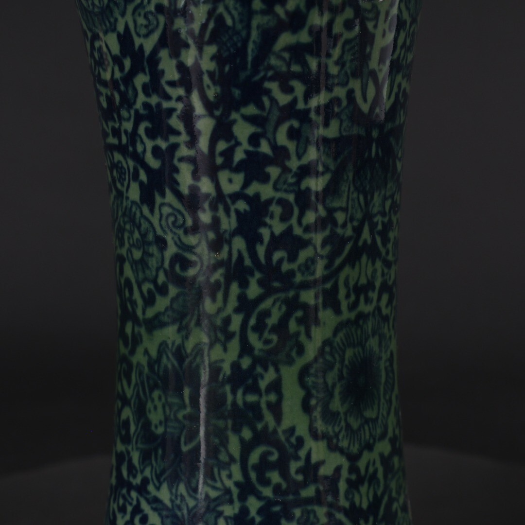 Green glazed blue and white entwined floral arrangement