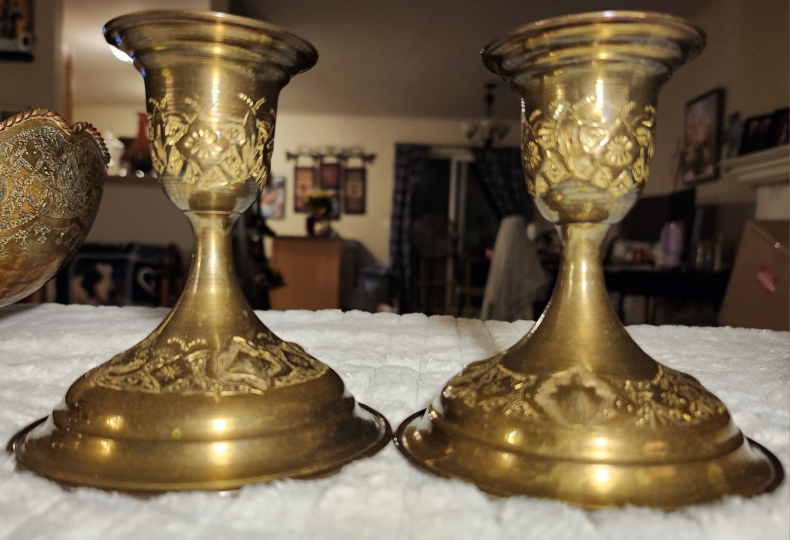 Antique Middle Eastern brass decorative set with engraved floral motifs.