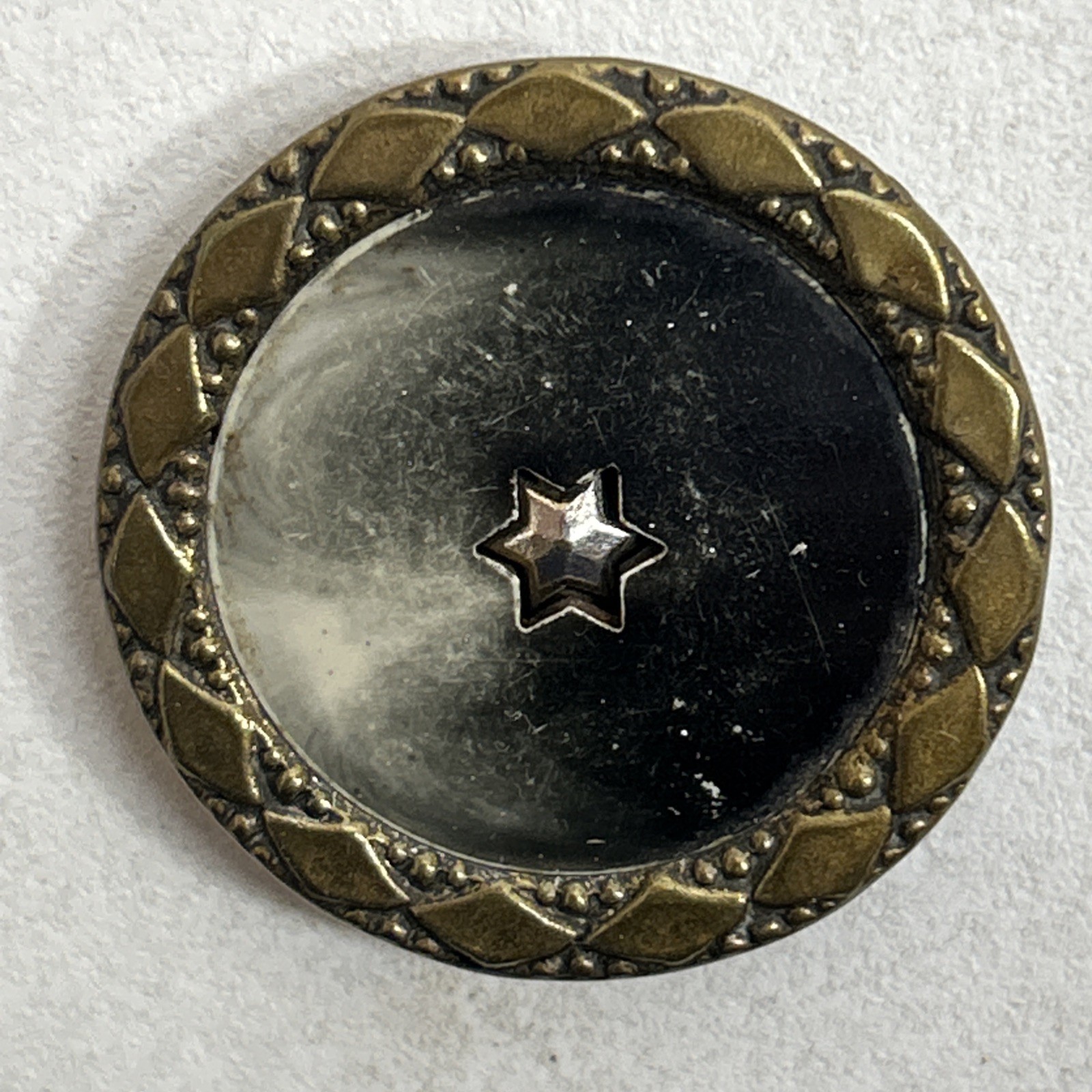 Antique Metal Celluloid Button Shooting Multifaceted Six Point Star Center