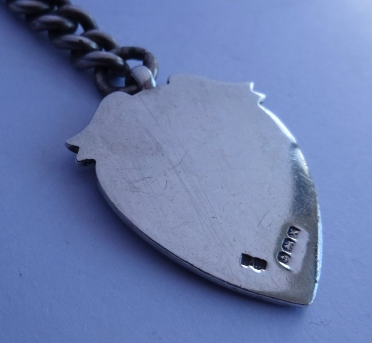 Antique solid silver pocket watch albert chain w/ silver & gold fob medal