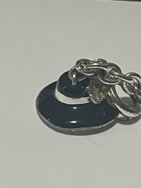 CLASSIC STAMPLED NAPIER SILVER TONE BRACELET WITH HAT CHARM & TOGGLE CLASP