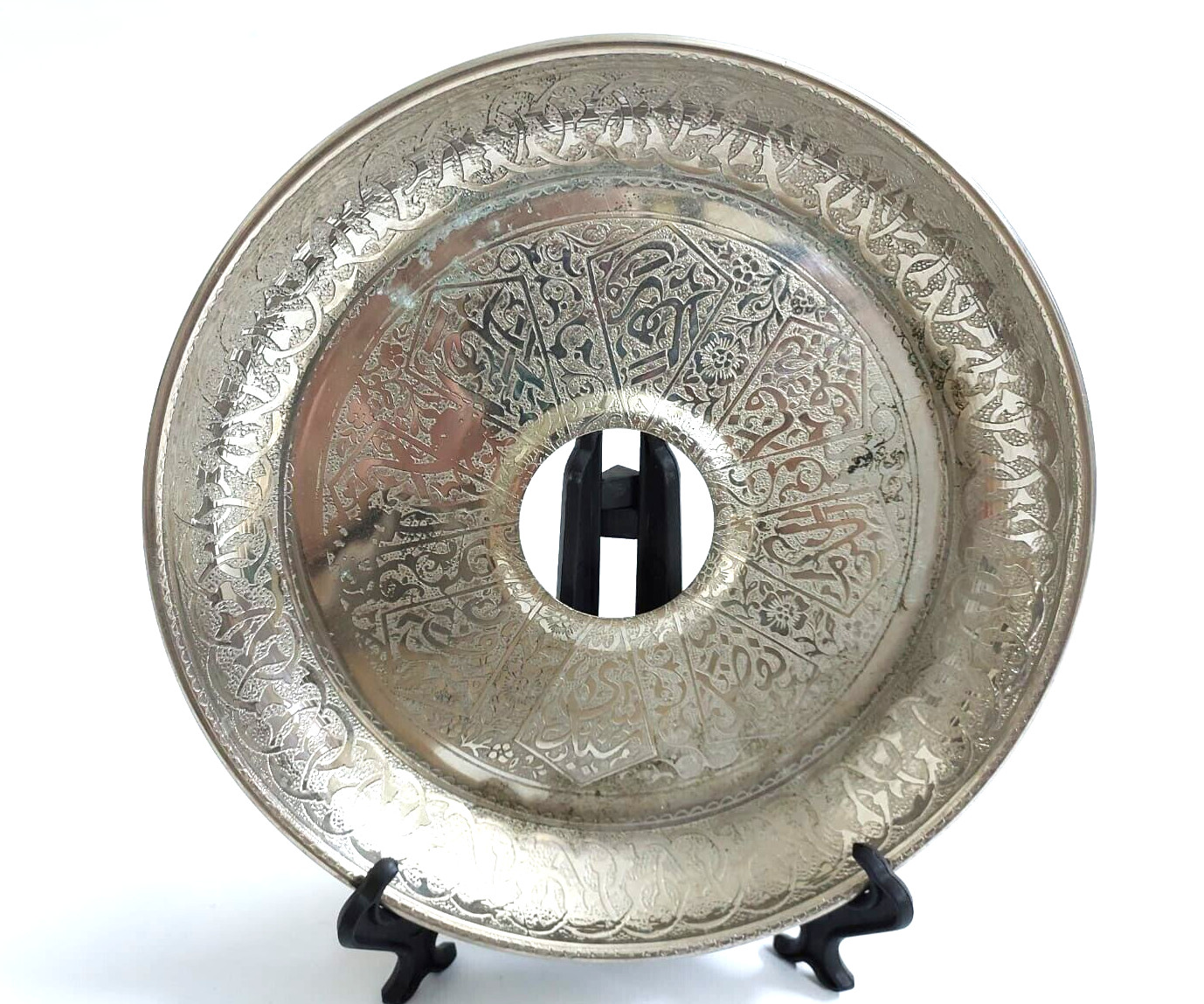 An ancient, silver-colored masterpiece, approximately 75 years old, bearing prom