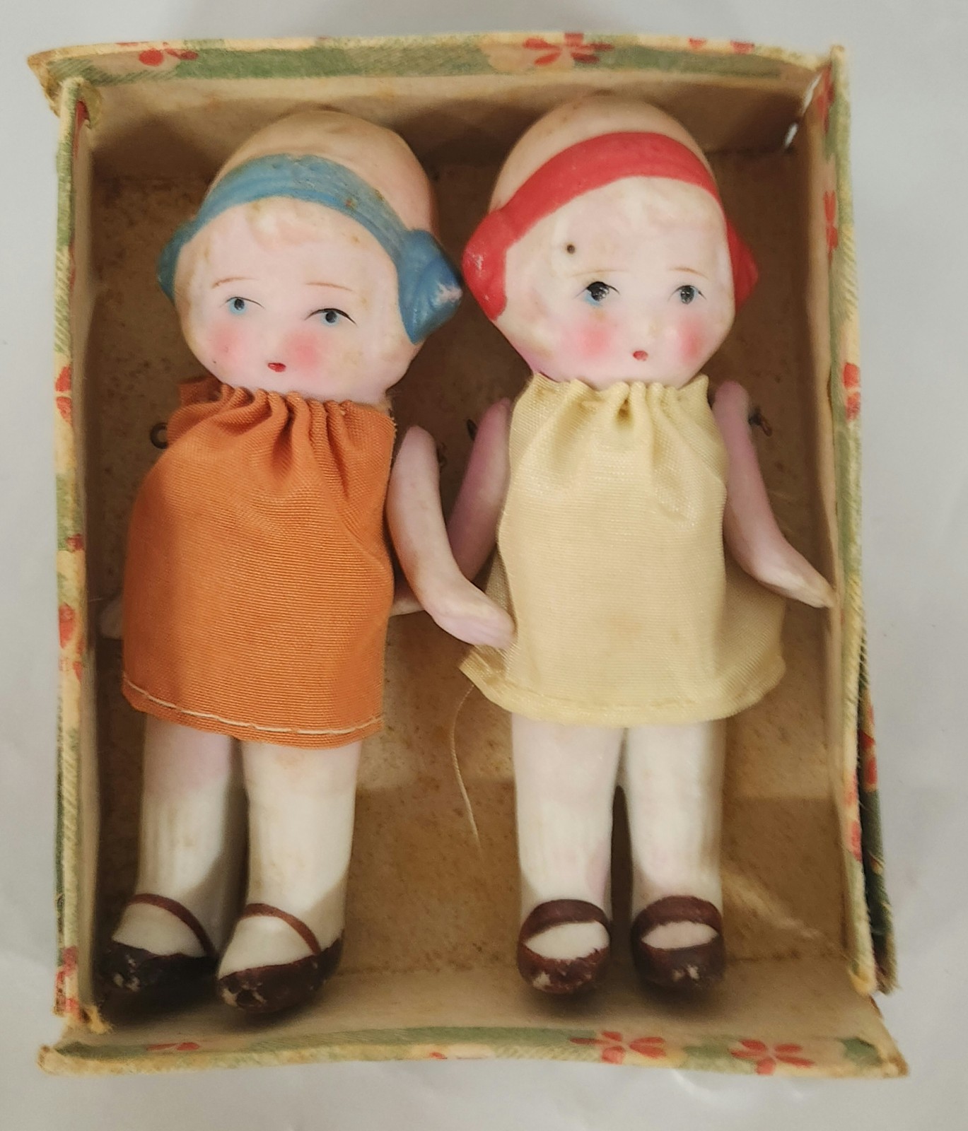 Two 4″ Bisque Articulated Doll Figures Japan Painted Headband Cloth Dress