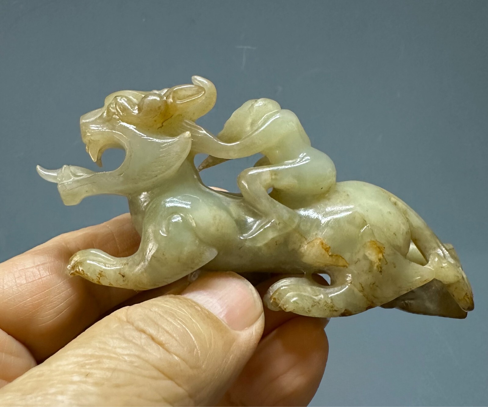 Antique Chinese Ming dynasty carved nephrite jade of Huren riding mythical beast