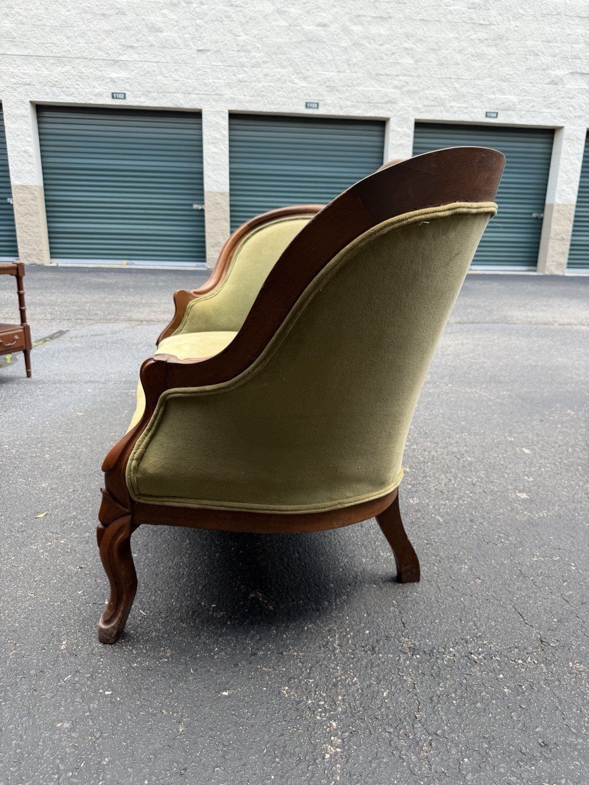 Antique Victorian settee with Green Velvet Upholstery & Carved Wooden Back