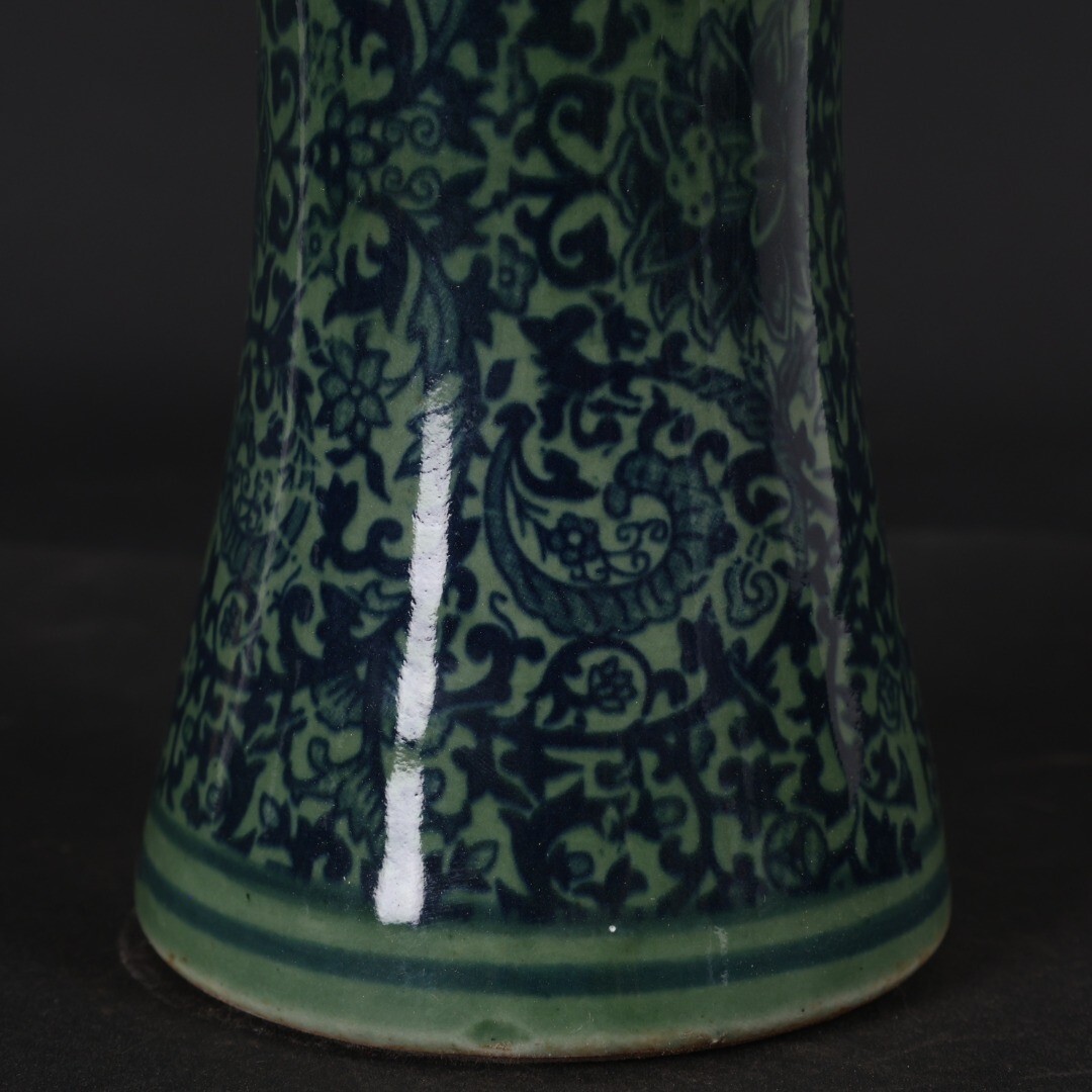 Green glazed blue and white entwined floral arrangement