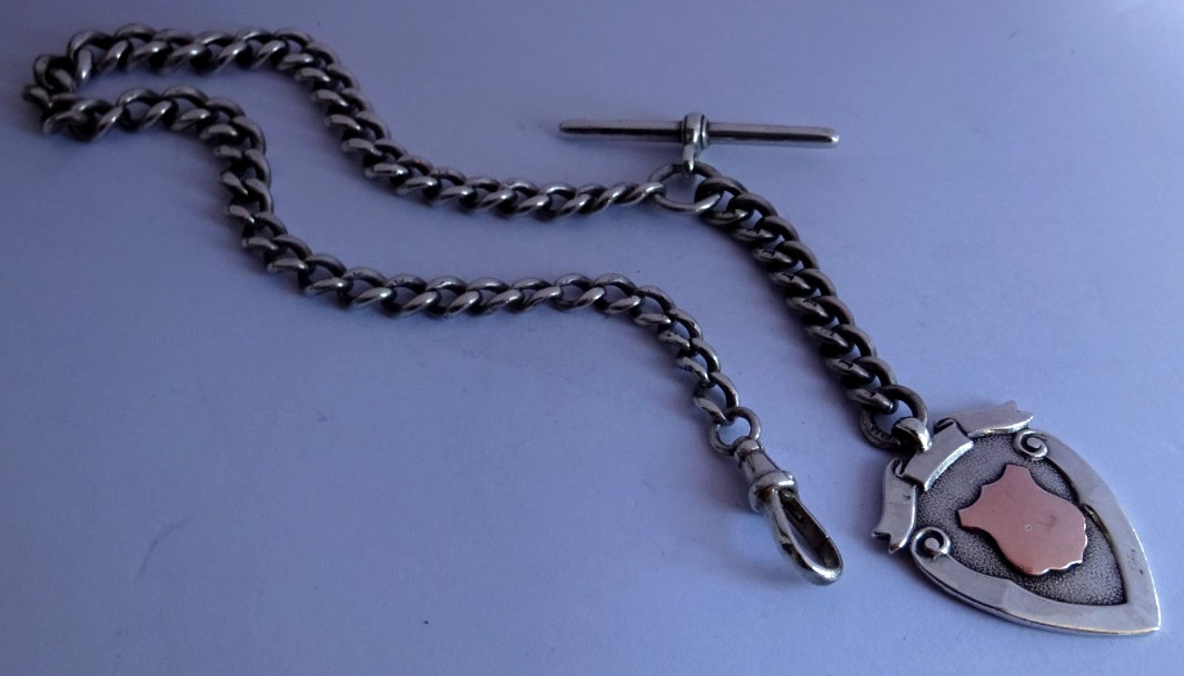 Antique solid silver pocket watch albert chain w/ silver & gold fob medal