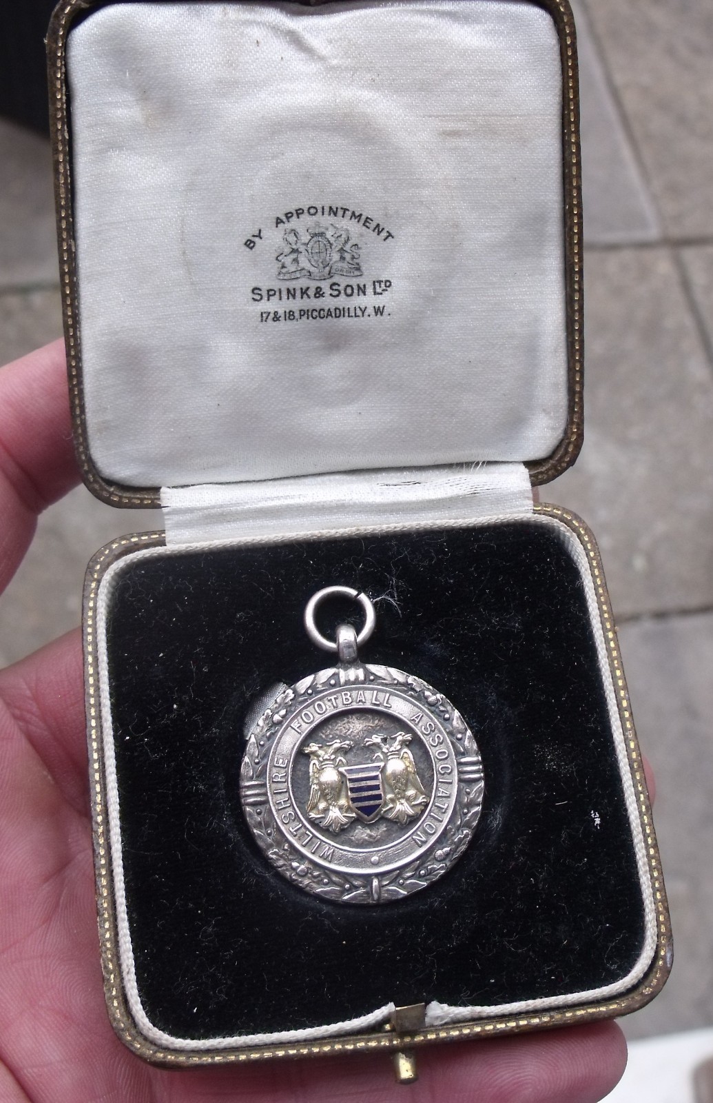 A 1937-38 STERLING SILVER, GOLD CREST WILTSHIRE FOOTBALL ASSOC. MEDAL, FOB.
