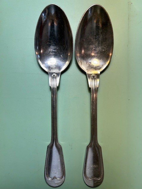 Two antique Fiddle & Thread table spoons by the French company Orfeverie Ercuis
