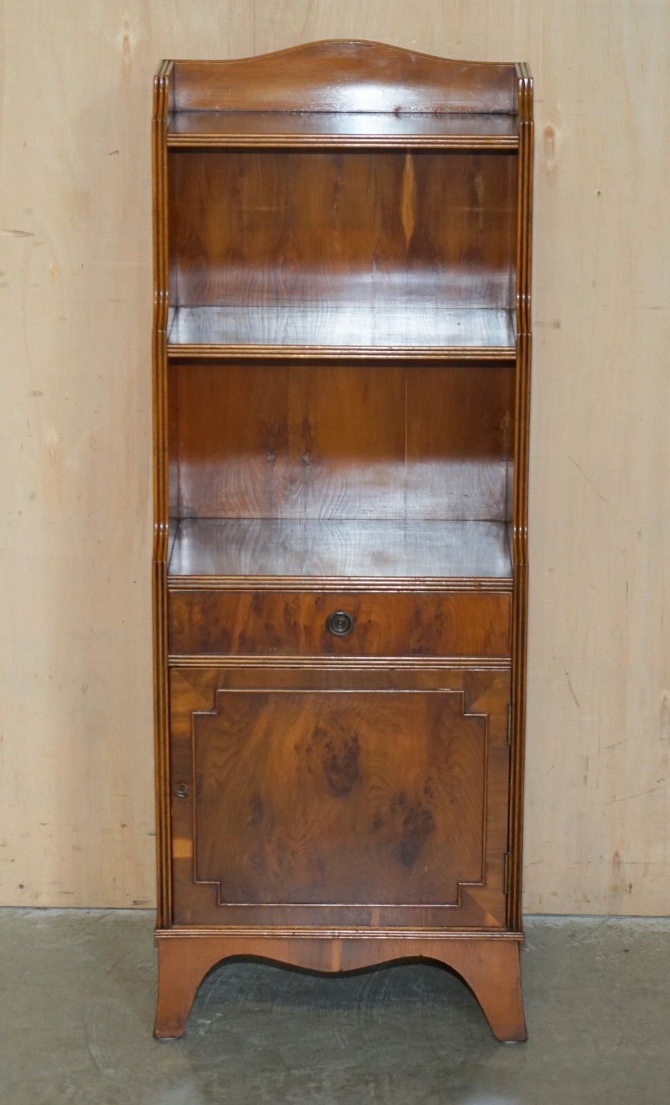 PAIR OF VINTAGE ENGLISH FLAMED MAHOGANY WATERFALL BOOKCASES WITH CUPBOARD BASES