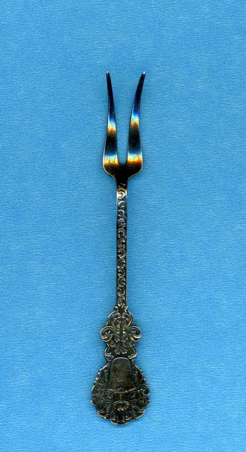 Vintage condiment fork silver plated and made in Sweden measuring 3 7/8 inches
