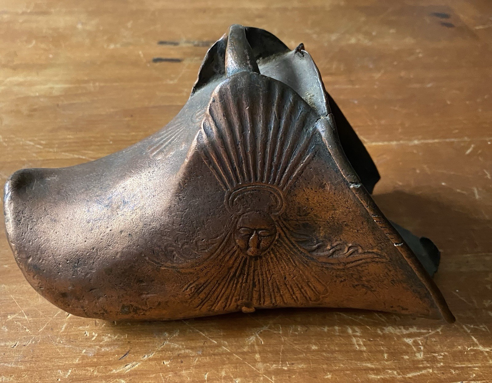 A single Conquistador stirrup, very ornate, Very Old armor shoe made of copper