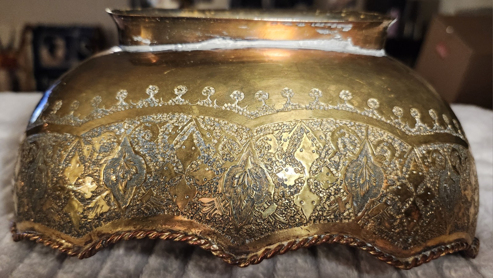 Antique Middle Eastern brass decorative set with engraved floral motifs.