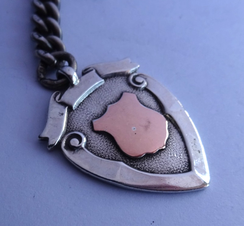 Antique solid silver pocket watch albert chain w/ silver & gold fob medal