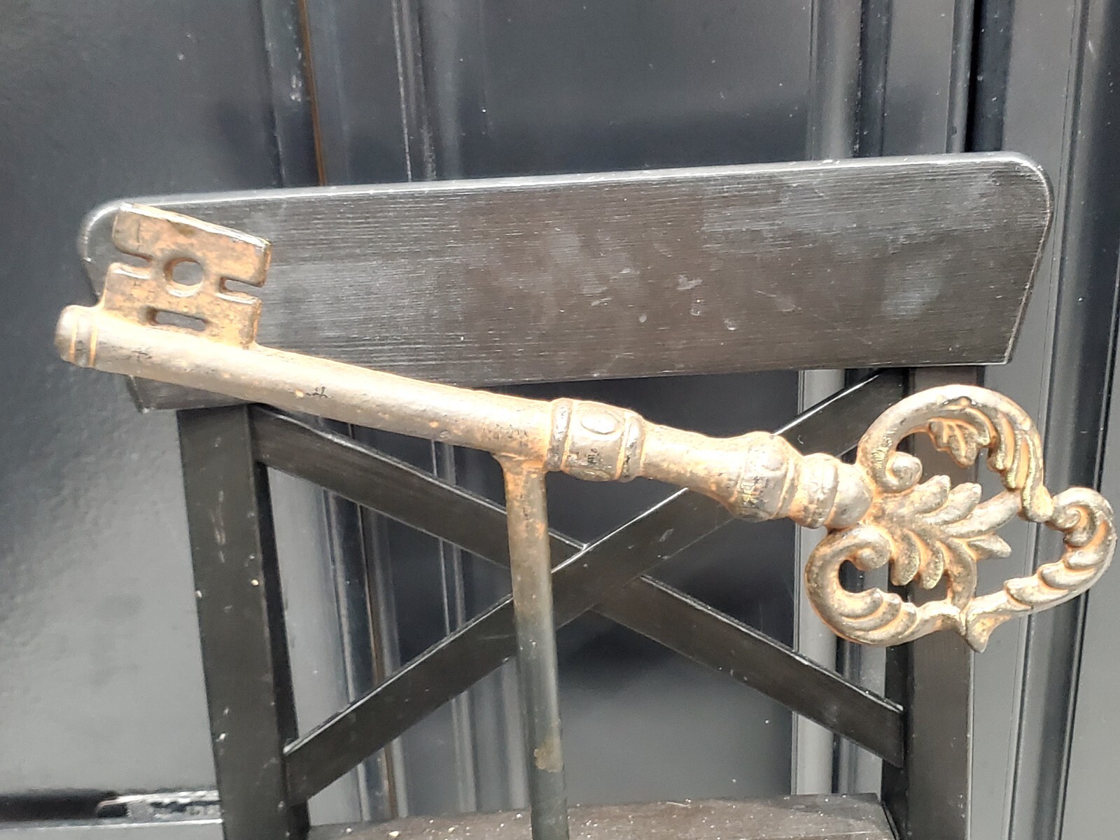 13in Antique Large solid cast iron key heavy on stand. Old church castle palace?
