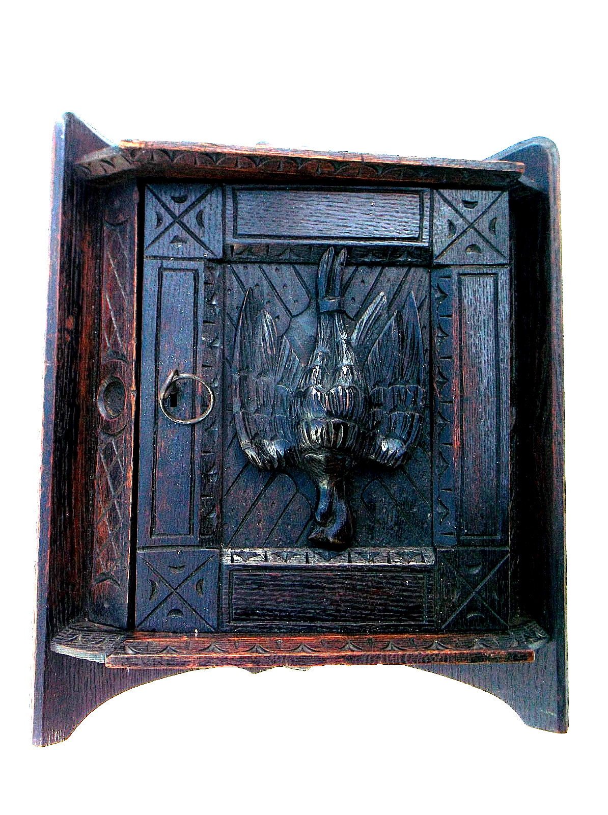 A RARE ANTIQUE OAK CORNER CABINET WITH A CARVED DEAD GAME BIRD ON THE FRONT DOOR