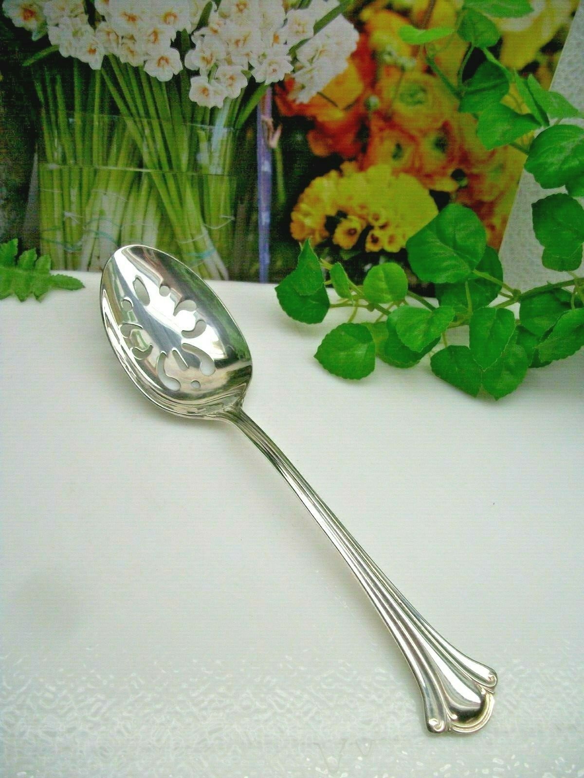 International Deep Silver SERENITY Silverplate Pierced Serving Spoon 1985