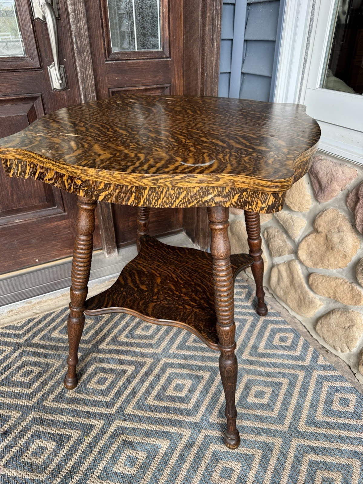 Antique Wooden Table veneer with ornate design and custom carved legs, mid-shelf