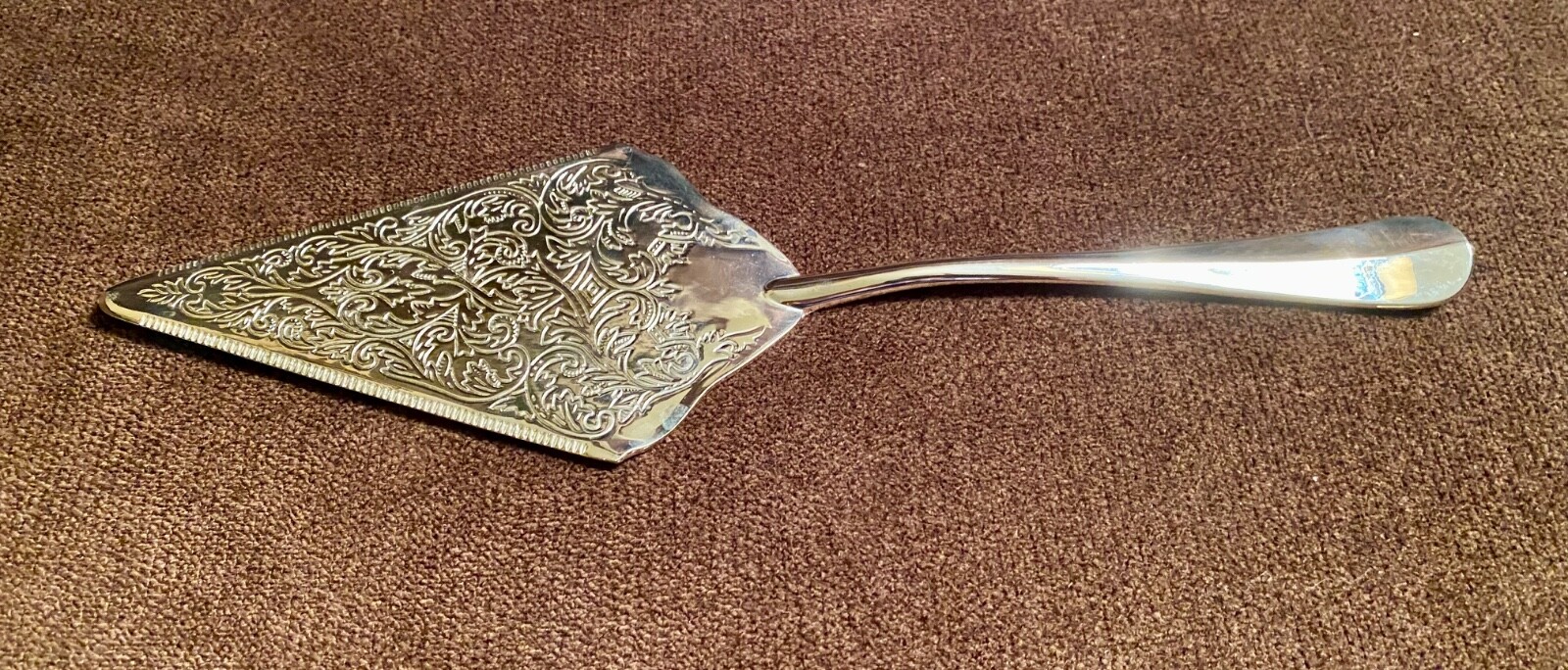 Stokes? ISC? engraved silverplate cake server, serrated edge