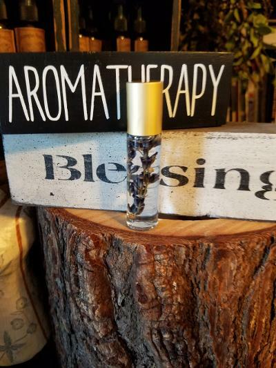 LAVENDER ESSENTIAL OIL ROLLER BOTTLE with lavender buds