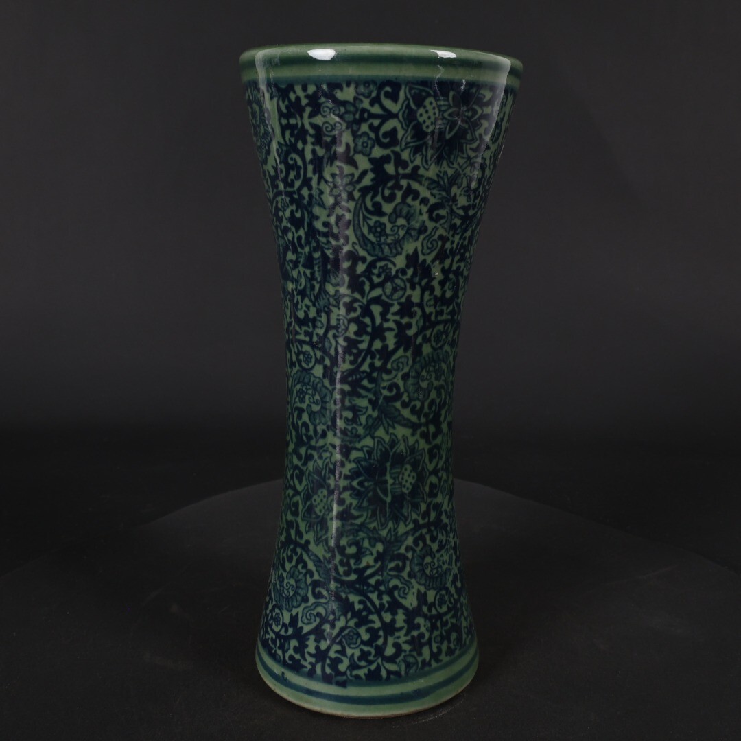 Green glazed blue and white entwined floral arrangement