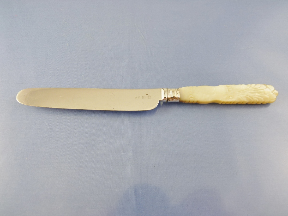 MOTHER OF PEARL ORNATE CARVED HANDLE DESSERT KNIFE BY unknown mark