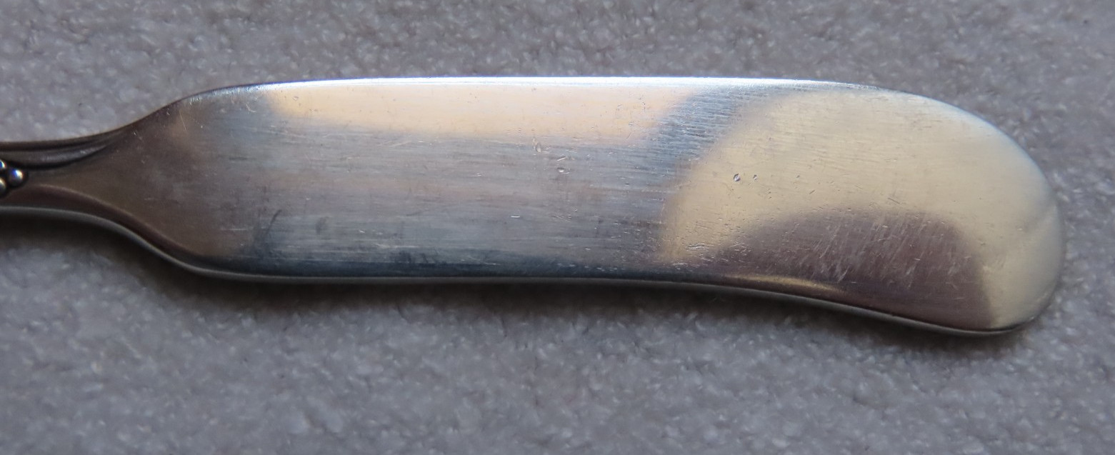 “Spring Glory” Flat Solid Butter Spreader Knife-5 3/4″ International Sterling