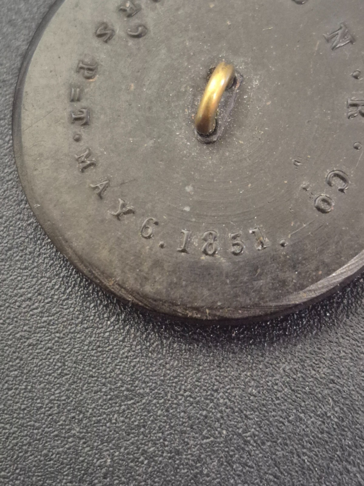 Antique 1851 Goodyear hard rubber button made by the Novelty Rubber Co. (N.R.Co)