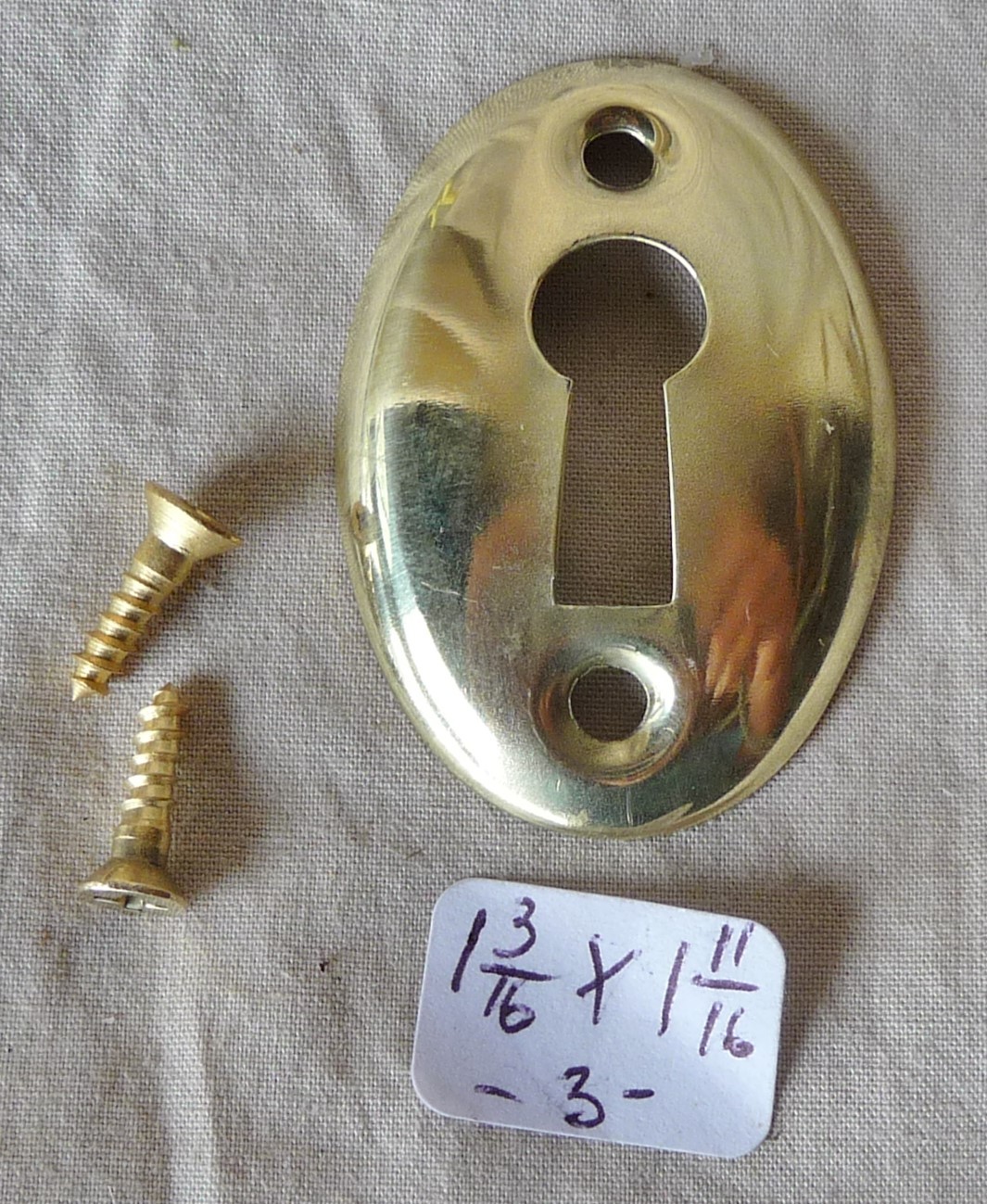 Door Keyhole Cover Antique Oval stamped brass 1 3/16″h x 1 11/16″w (per ea)