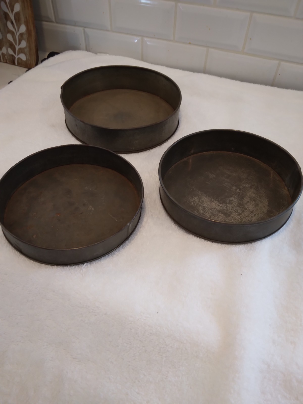 3 Primitive tin cake pans/different sizes