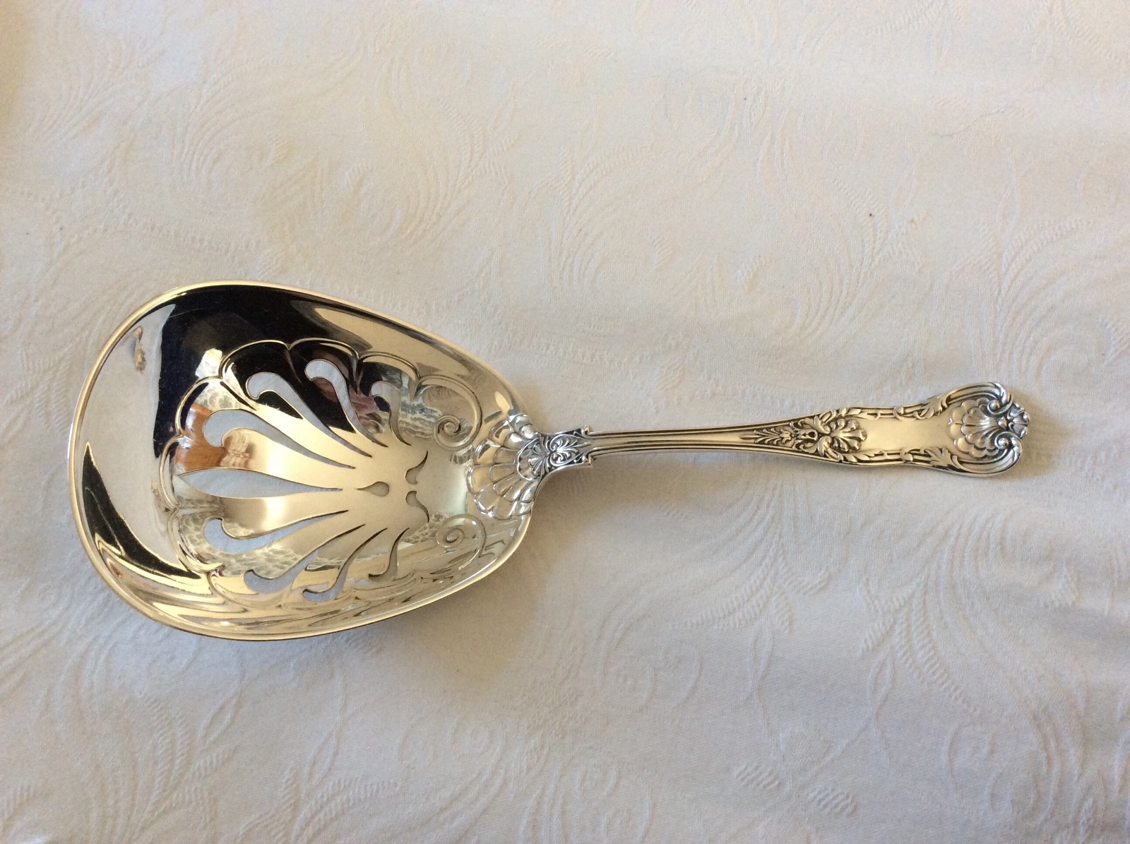 Sterling New Queens cracker or Saratoga Chip pierced serving spoon