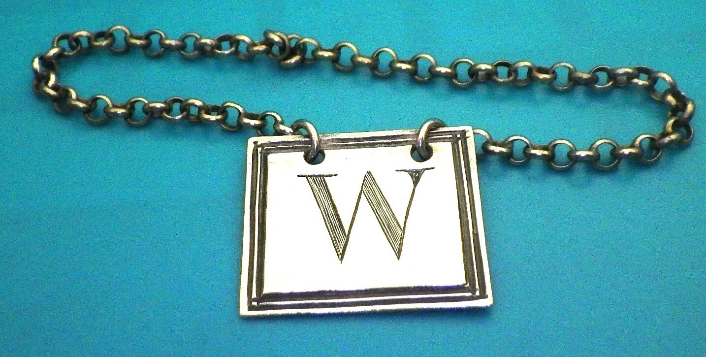 A Victorian silver “W” wine label by William Knight c.1845